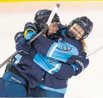  ?? TODD KOROL THE CANADIAN PRESS ?? Team Bauer’s Marie-Phillip Poulin, left, celebrates her game-winning goal with teammate Jessie Eldridge on Sunday.