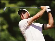  ?? LM Otero / Associated Press ?? Scottie Scheffler watch his tee shot off the eighth hole during the second round of the Charles Schwab Challenge at the Colonial Country Club on Friday in Fort Worth, Texas.