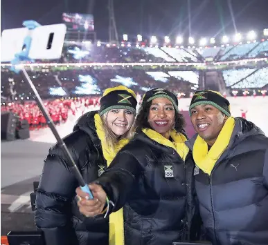  ?? AP ?? Former national women’s bobsleigh team driving coach Sandra Kiriasis (left) with Jazmine Fenlator-Victorian and skeleton competitor Anthony Watson at last Friday’s opening ceremony of the 2018 Winter Olympics in Pyeongchan­g, South Korea.