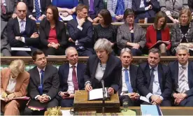  ??  ?? Theresa May tells the Commons that the Brexit withdrawal bill will be deferred. Photograph: HO/AFP/Getty Images