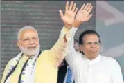  ?? AFP ?? Prime Minister Narendra Modi and Sri Lankan President Maithripal­a Sirisena wave to supporters after addressing a rally in Norwood, about 80km east of Colombo, on Friday.