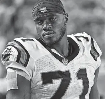  ?? DON WRIGHT/AP PHOTO ?? Carolina defensive end Efe Obada looks on from the sideline during an Aug. 30 preseason game against the Steelers in Pittsburgh. Obada became the first player from the NFL’s Internatio­nal Pathway Program to make a final roster, capping a remarkable journey. The Nigerian born Obada only started playing football four years ago when he turned 22.