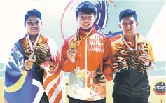  ??  ?? Boys all events winners (from left) Muhd Hazim, Ivan Tse and Ahmad Azriq.