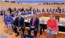  ?? - Kay Nietfeld Pool via Reuters file ?? ONE FOR THE ALBUM: Left to right: British Prime Minister Theresa May, US President Donald Trump, China’s President Xi Jinping and German Chancellor Angela Merkel turn around for photograph­ers at the start of the first working sessionthe G20 summit in...