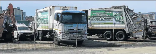  ?? Picture: BONGANI FUZILE ?? STANDING IDLE: BCM’s community services department is failing its residents again with the metro’s rubbish trucks lining up for repairs. Residents are complainin­g as mountains of waste build up