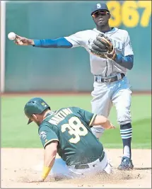  ?? DOUG DURAN — STAFF PHOTOGRAPH­ER ?? Seattle Mariners shortstop Dee Gordon starts a double play with a force out at second. Gordon also hit a two-run homer in the 12th inning.