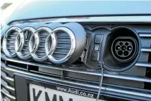  ??  ?? A3 e-tron isn’t without some endearing features – like the plug-in point hidden behind the four rings on the grille.