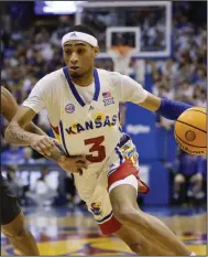  ?? (AP/Colin E. Braley) ?? Kansas guard Dajuan Harris Jr. powered the Jayhawks with 14 second-half points as they rallied for an 87-71 victory over Baylor on Saturday in Lawrence, Kan.