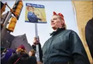  ?? BRIAN SANCHEZ/THE ARGUS LEADER VIA ASSOCIATED PRESS ?? Sheila Dathe wears a “Rosie the Riveter” inspired work uniform to the Women’s March in Sioux Falls, S.D., on Saturday.