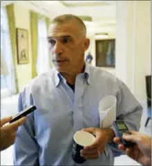  ?? THE ASSOCIATED PRESS ?? Former Yankees manager Joe Girardi talks with reporters at the annual MLB general managers’ meetings on Tuesday.