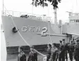  ?? Korea Central News Agency file ?? North Korean soldiers watch the USS Pueblo, which was seized by the North Korean navy off the Korean coast in January 1968, near Taedong River in Pyongyang. North Korea considers the ship its greatest Cold War prize, a potent symbol of how the country has stood up to the great power of the United States.