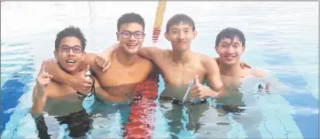  ??  ?? Zachary Tan (second left), Hii Puong Wei (second right), Joash Voon (left) and Hii Puong Hou cooling down at the pool yesterday.