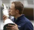  ?? PETER MORRISON — ASSOCIATED PRESS ?? Jordan Spieth of the United States kisses the trophy after winning the British Open on Sunday.