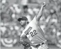  ??  ?? Dodgers starting pitcher Clayton Kershaw throws during Game 5 of the NLCS on Wednesday in Los Angeles.