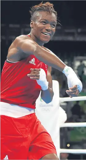 ??  ?? A jubilant Nicola Adams on securing back-to-back Olympic golds.