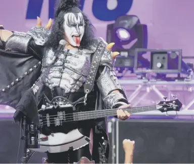  ??  ?? 0 Bass player Gene Simmons was, as usual, larger than life, waggling his tongue and regurgitat­ing fake blood