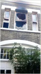  ??  ?? CHARRED: Fire-damaged upstairs windows at the London home of model Lizzy Jagger, right