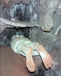  ??  ?? Geologist Dr Hannah Hilbert-wolf studying difficult to reach flowstones in a small side passage in the Dinaledi Chamber.