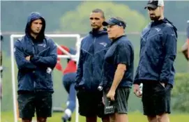  ?? FILE/MATTHEW J. LEE/GLOBE STAFF ?? In 2023, Celtics coach Joe Mazzulla (second from left) visited training camp, where he talked defense with Bill Belichick.