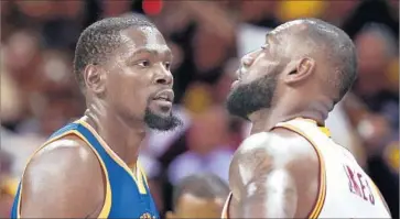  ?? Ronald Martinez Getty Images ?? KEVIN DURANT, left, and LeBron James have been spectacula­r in the NBA Finals, but the overall talent of Durant’s Warriors has overwhelme­d James’ Cavaliers in the first three games.