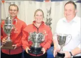  ??  ?? From left, Neil Umpleby, Diane Russell and Graham Freeman with some of their trophies