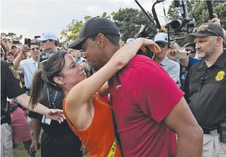  ?? Picture: PGA TOUR ?? Tiger Woods and his girlfriend Erica Herman celebrate after the final round of the Tour Championsh­ip.
