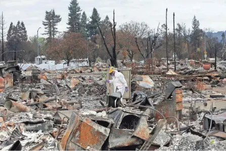  ??  ?? Work crews remove debris at the site of a home destroyed by wildfires in the Coffey Park area of Santa Rosa, Calif., last November. California Office of Emergency Services Director Mark Ghilarducc­i complained to the Army that contractor­s it paid by the ton to clear debris took too much dirt and damaged or removed perfectly fine driveways.