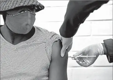  ?? SIPHIWE SIBEKO/AP ?? A volunteer receives a COVID-19 test vaccine injection June 24 in Johannesbu­rg, South Africa.