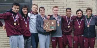  ?? COURTESY ROCKY RIVER CROSS COUNTRY ?? The Rocky River boys cross country team display their Regional champion trophy after taking first at the Youngstown Region meet on Oct. 28 with a score of 67.