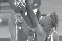  ?? MIKE STOBE/AP ?? Jimmy Butler drives to the net against the Knicks during Monday night’s game in New York.