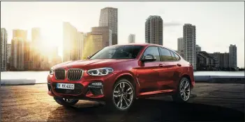  ?? BMW AG ?? The new BMW X4 xDrive for 2019 commands attention with a coupe-like roofline, athletic curves, and compelling color choices.