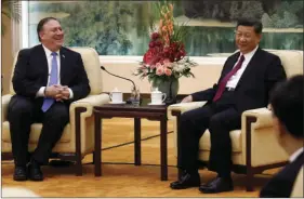  ?? AP PHOTO/ ANDY WONG, POOL ?? U.S. Secretary of State Mike Pompeo (left) shares a light moment with Chinese President Xi Jinping during their meeting at the Great Hall of the People in Beijing on Thursday.