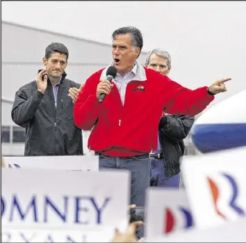  ?? STAFF FILE ?? Then-GOP presidenti­al candidate Mitt Romney, flanked by his running mate Paul Ryan and Ohio Sen. Rob Portman, campaigned at Dayton Internatio­nal Airport.