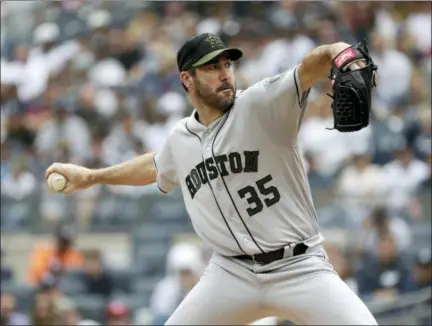  ?? SETH WENIG — ASSOCIATED PRESS ?? Astros pitcher Justin Verlander throws during the first inning of Monday’s game at Yankee Stadium in New York.