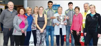  ?? Photos at top of page by Joe Hanley ?? Teachers from CBS the Green got their hands on Minor Football and Minor Hurling Cups at the school’s funrunonSu­nday.