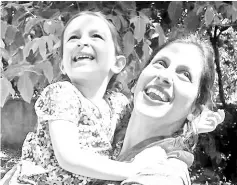  ??  ?? Zaghari-Ratcliffe embracing her daughter Gabriella in Damavand, Iran following her release from prison for three days. — AFP photo