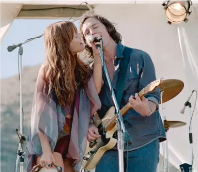  ?? PRIME VIDEO ?? Riley Keough and Sam Claflin star as the leaders of tumultuous rock band on “Daisy Jones & the Six.”