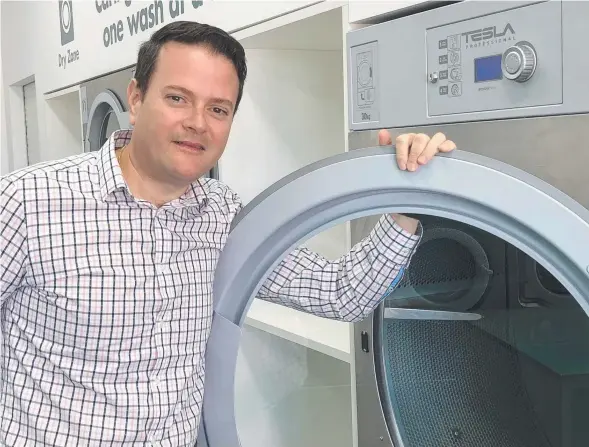  ??  ?? ENERGY CONSCIOUS: Green Laundry owner Ed Greenidge has introduced modern laundromat­s to Geelong.