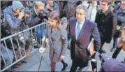  ?? AP ?? Michael Cohen, accompanie­d by his children, arrives at a federal court for his sentencing in New York on Wednesday.