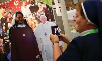  ??  ?? A nun snaps her friend next to a cardboard cut-out of the pope at last year’s World Congress of Families in Dublin. Photograph: Hannah Mckay/Reuters