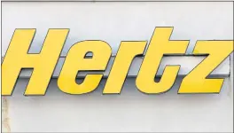  ?? STEVEN SENNE — THE ASSOCIATED PRESS FILE ?? Car rental company Hertz is ordering 100,000 electric vehicles from Tesla. The company says it’s buying the Tesla Model 3s by the end of 2022, and it also will buy electric vehicle chargers. No price was given for the order, but it has to be worth around $4 billion because each Model 3 has a base price of around $40,000.