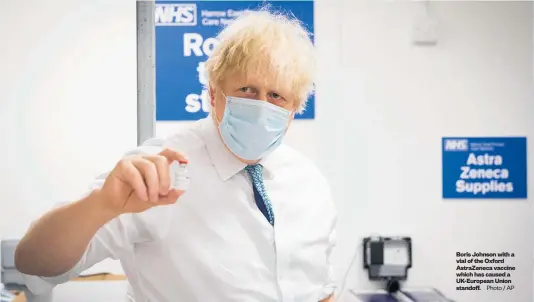  ?? Photo / AP ?? Boris Johnson with a vial of the Oxford AstraZenec­a vaccine which has caused a UK-European Union standoff.