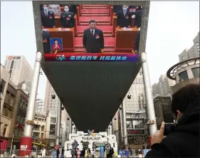  ?? REUTERS ?? A giant screen shows Chinese President Xi Jinping attending the closing session of the National People’s Congress (NPC) at the Great Hall of the People, in Beijing, China on 11 March.