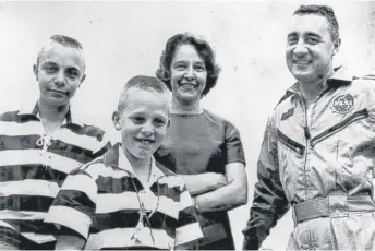  ?? AP FILES ?? Virgil “Gus” Grissom is reunited with his wife, Betty, and sons Scott (left) and Mark at Cape Kennedy, Florida, after his three-orbit flight on March 25, 1965.