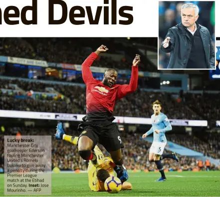  ?? — AFP ?? Lucky break: Manchester City goalkeeper Ederson fouling Manchester United’s Romelu Lukaku to give away a penalty during the Premier League match at the Etihad on Sunday. Inset: Jose Mourinho.