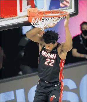  ?? MIKE EHRMANN/GETTY IMAGES ?? Jimmy Butler was the late-game hero for the Heat for the third game in a row against Milwaukee.