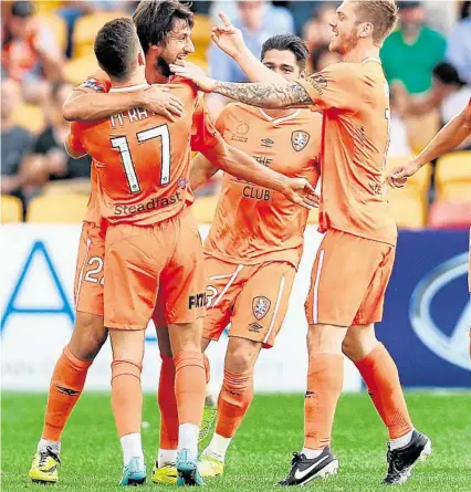  ?? PHOTO: DAN PELED/AAP ?? GOAL TIME: Brisbane Roar players celebrate Thomas Broich’s goal against Adelaide United.