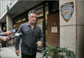  ?? PHOTO — JULIE JACOBSON ?? Actor Alec Baldwin walks out of the New York Police Department’s 10th Precinct, Friday in New York. Baldwin was arrested Friday after allegedly punching a man in the face during a dispute over a parking spot outside his New York City home, authoritie­s said.