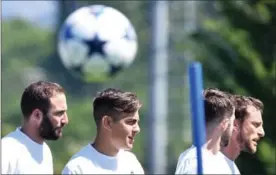  ?? ALESSANDRO DI MARCO, THE ASSOCIATED PRESS ?? Juventus players, from left, Gonzalo Higuain, Paulo Dybala and Claudio Marchisio, right, attend a training session Tuesday ahead of Wednesday’s soccer match against Monaco.