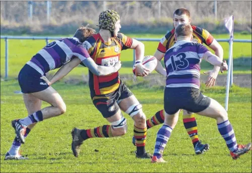  ?? Pictures: Paul Amos FM4680263, above; FM4680275, right ?? Above, Ashford attempt a deft pass during Saturday’s game. Right, the hosts are half caught by Gillingham Anchorians